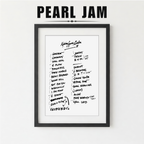Framed list of Pearl Jam album tracklist with a plant on a white background