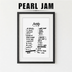 Framed Pearl Jam album tracklist with a plant on a white surface
