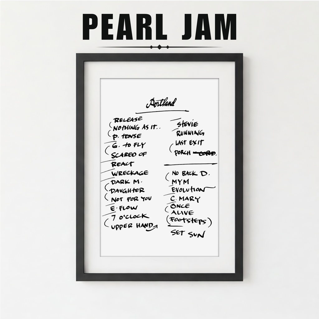 Framed Pearl Jam album tracklist with a plant on a white surface