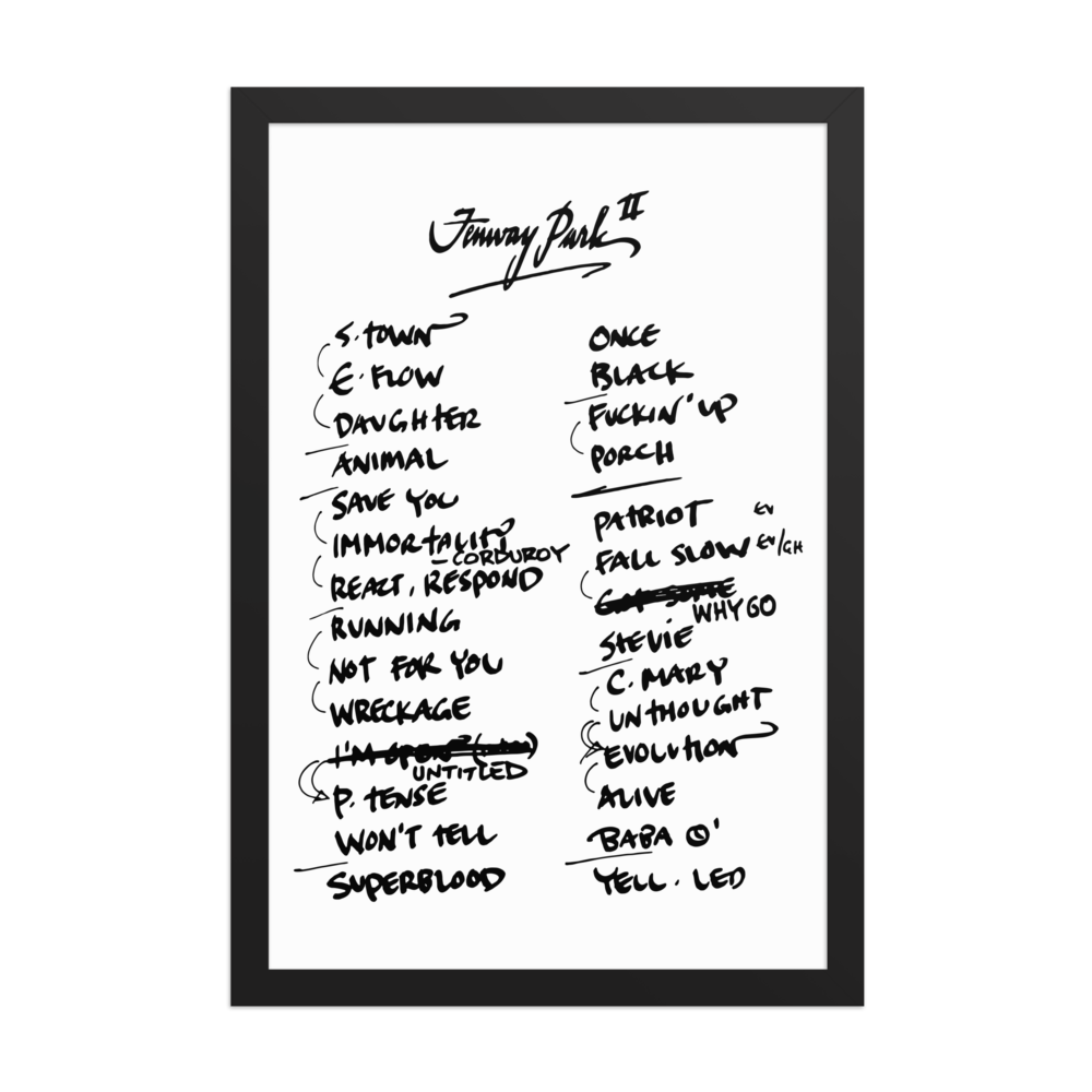 Framed poster with handwritten setlist on a white background