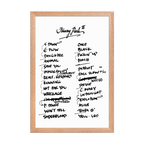 Framed poster with handwritten setlist on a white background