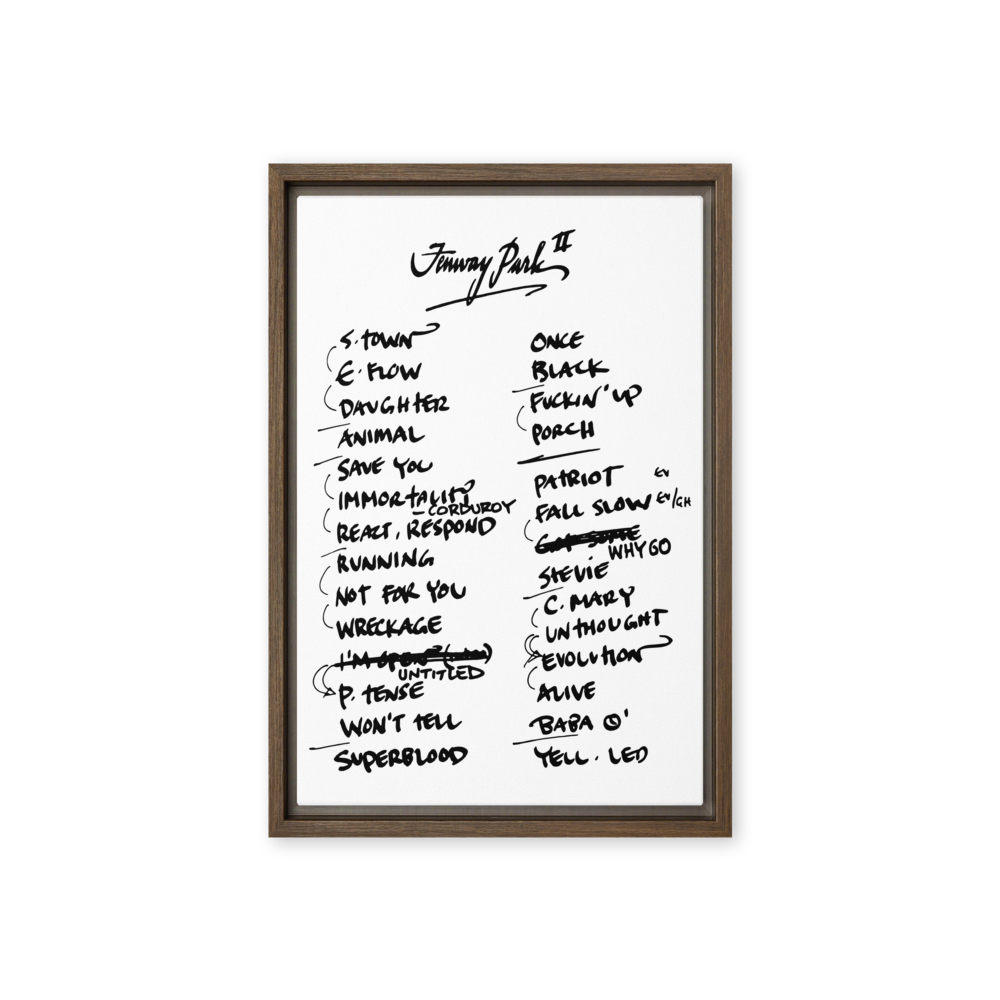 Framed poster with handwritten track list on a white background
