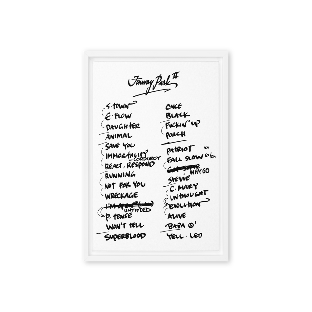 Framed poster with handwritten album tracklist on a white background