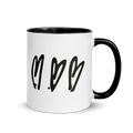 White mug with black interior, handle, and heart design on a white background
