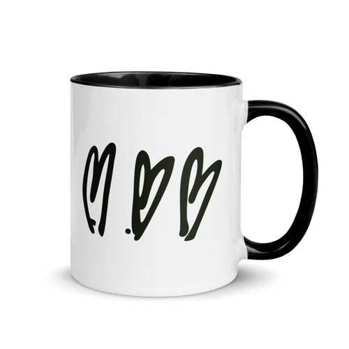 White mug with black interior, handle, and heart design on a white background