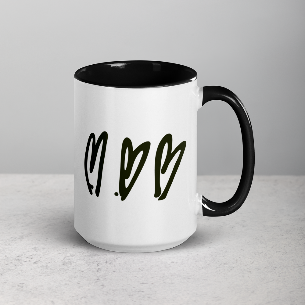 White mug with black interior, handle, and text on a light gray background